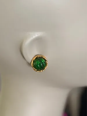 Vintage Green Avon earrings feature a prominent green, ribbed glass cabochon stone